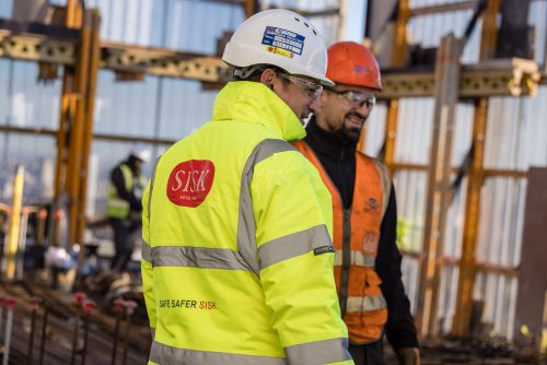 Two people at the glass bottle site